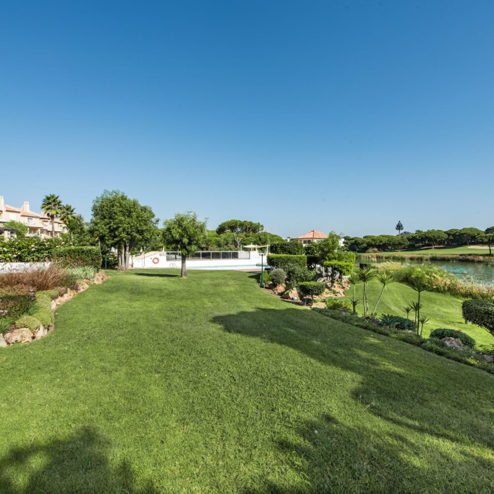 Two bedroom apartment for sale within Sao Lourenco resort, Quinta do Lago communal garden by lake